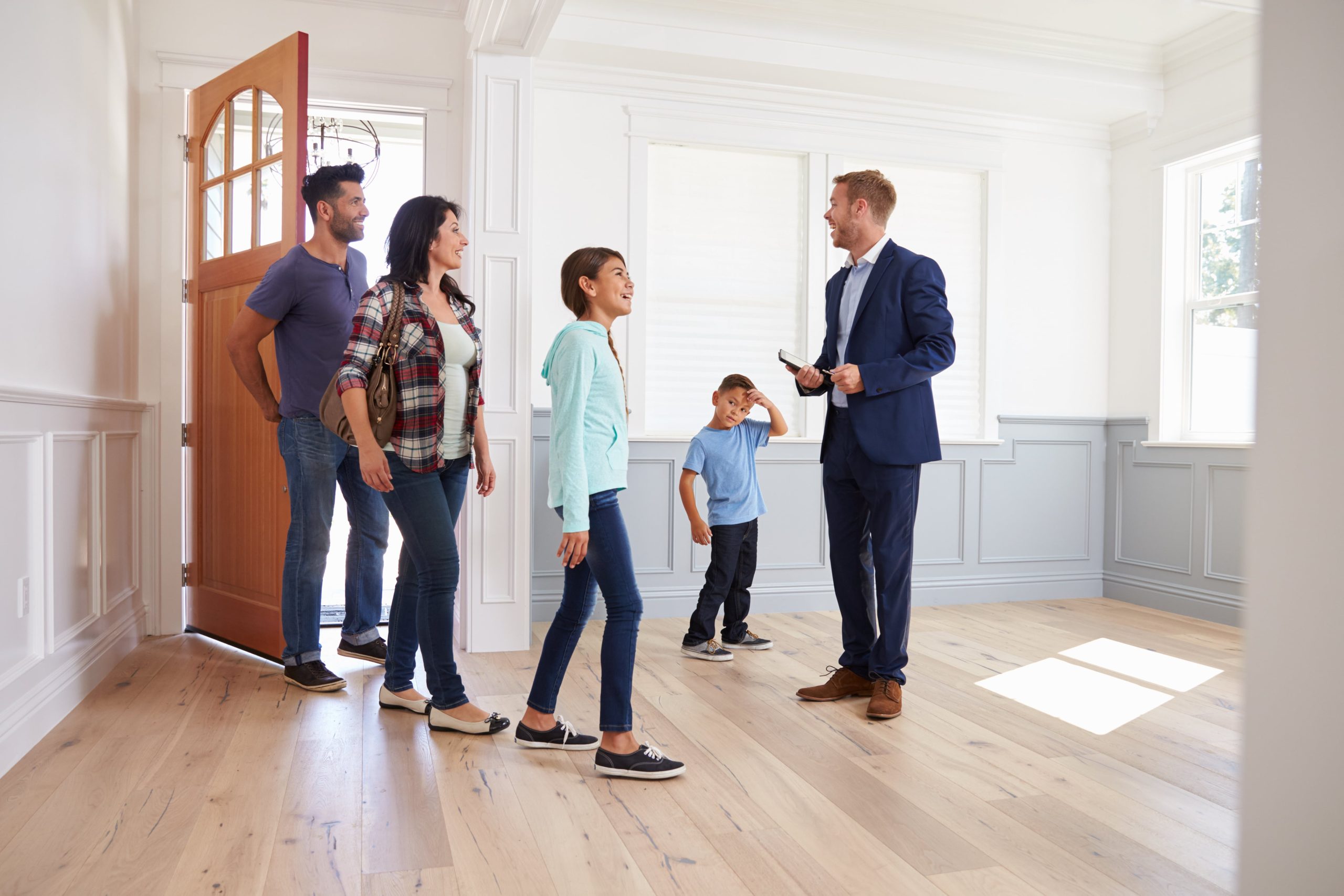 Realtor showing family around home