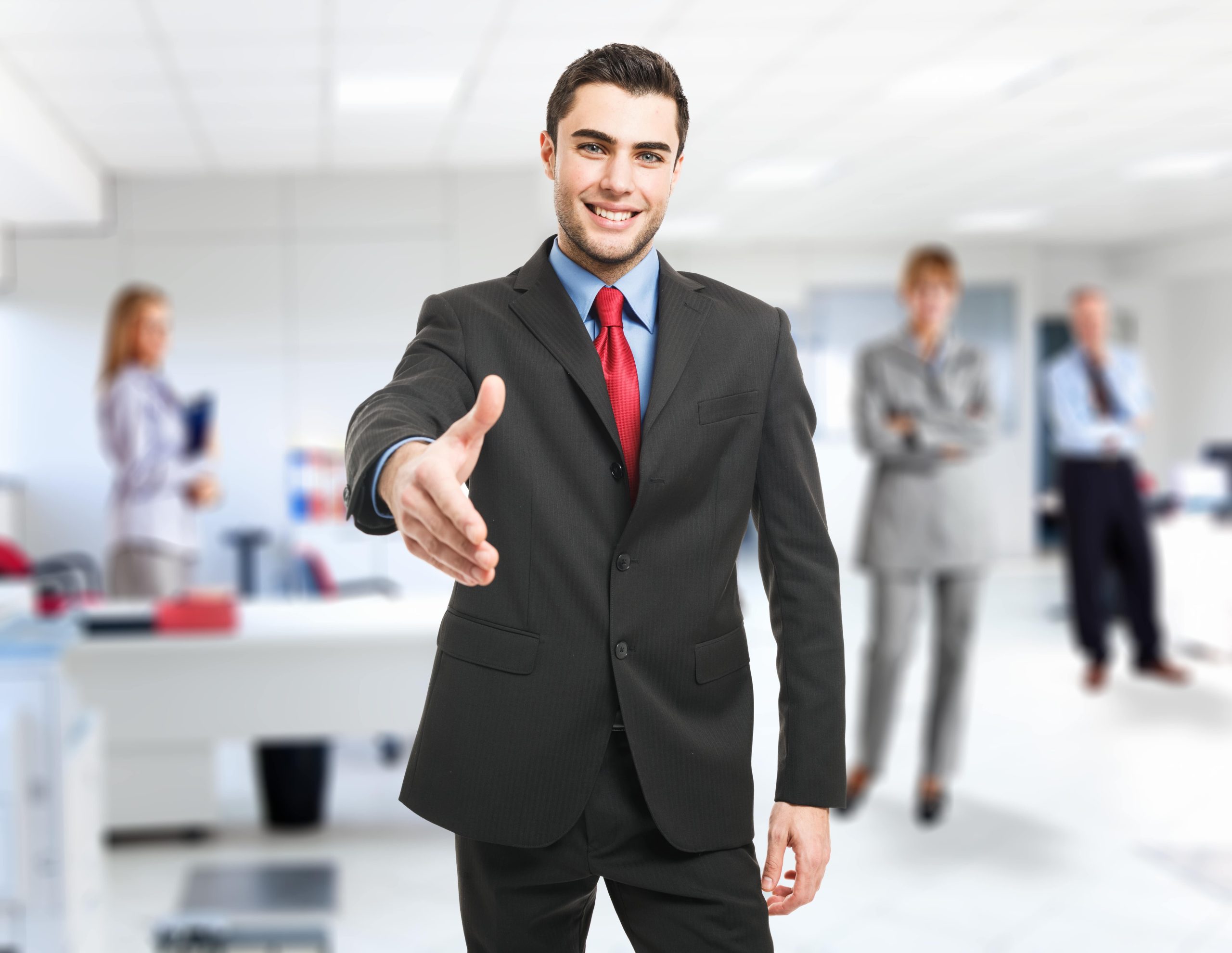 Businessman holding out hand to shake